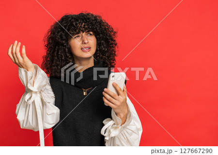 Upset sad woman use smartphone play game loses loss fail unlucky news bad lottery results crisis 127667290