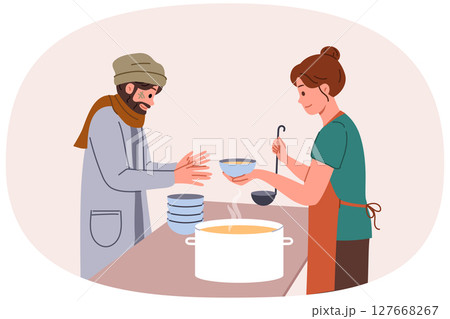Homeless man receives food from female volunteer from shelter for poor people who are unemployed 127668267