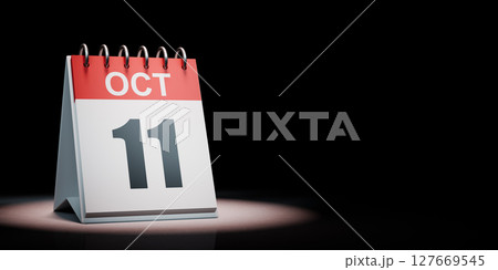 October 11 Calendar Spotlighted on Black Background 127669545