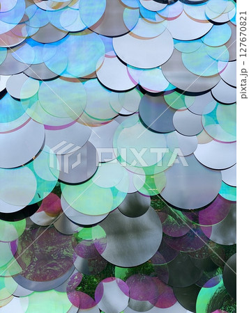 Colorful abstract circular pattern creating dynamic textured background 127670821