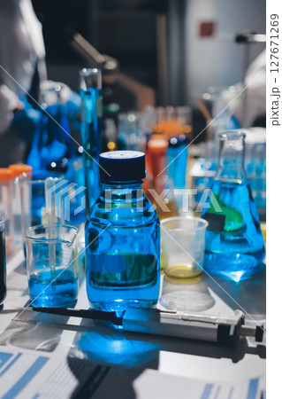 Scientist pipetting medical samples into microplate in laboratory Scientist pipetting medical samples into microplate in laboratory 127671269