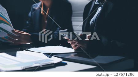 Two business people analyzing the data Two business people analyzing the data 127671296