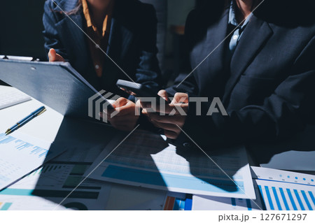Two business people analyzing the data Two business people analyzing the data 127671297