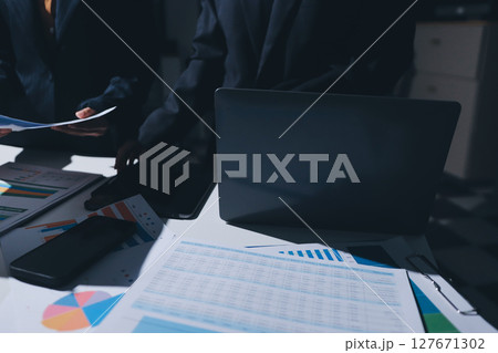 Two business people analyzing the data Two business people analyzing the data 127671302
