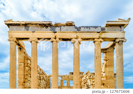 The Erechtheion temple in blue and cloudy sky background 127671606