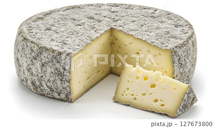 A large whole wheel of gourmet aged cheese with a slice cut out, showcasing a creamy texture and holes on a white background. 127673800