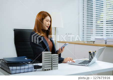 Real estate concepts choose a house to buy different offers of real estate online. 127673916