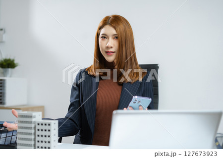 Home loan officer holding model home loan concept. Home loan officer holding model home loan concept. 127673923