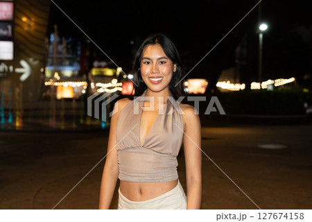 Attractive Woman at Night in Urban City Lights Attractive Woman at Night in Urban City Lights 127674158