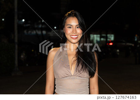Attractive Woman at Night in Urban City Lights Attractive Woman at Night in Urban City Lights 127674163