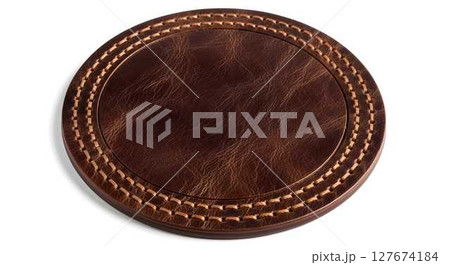 Empty brown leather label with stitching on a white background, top view, for branding and product design. 127674184