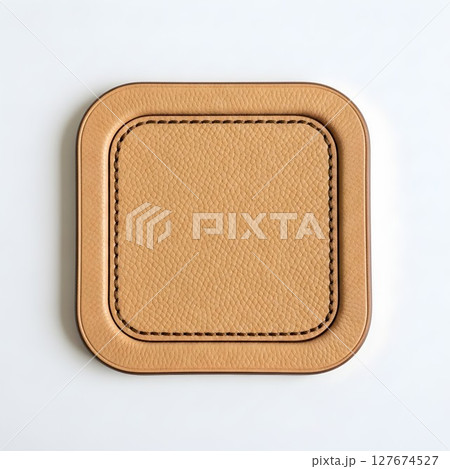 Square leather tag with decorative stitched border. Blank label for branding, fashion, craft, or product advertisement. 127674527