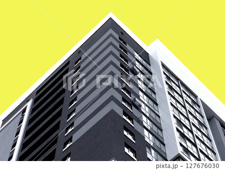 Building corner with modern high rise architecture and yellow facade. Geometric vertical structure Building corner with modern high rise architecture and yellow facade. Geometric vertical structure 127676030