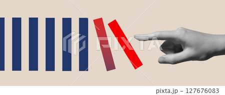Hand breaking red domino block in blue pattern. Concept of disruption, innovation, rebellion, 127676083