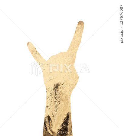 Hand gesture showing rock horns symbol in gold foil texture. Bold silhouette with shiny metallic 127676087
