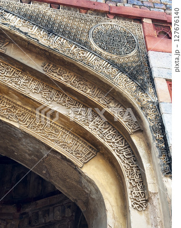 India Delhi October 18 2024 Calligraphy inscription carved in stone arch at mosque entrance in Delhi India Delhi October 18 2024 Calligraphy inscription carved in stone arch at mosque entrance in Delhi 127676140