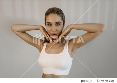 Portrait of young beautiful woman with perfect smooth skin isolated over background. Tenderness and sensuality. Concept of natural beauty, plastic surgery, cosmetology, cosmetics, skin care 127676336