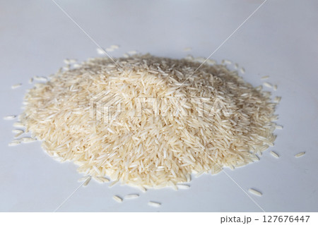 A pile of dry white rice A pile of dry white rice 127676447