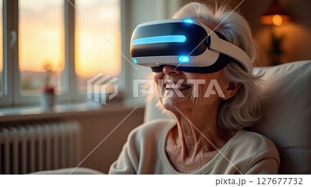 Elderly woman with VR headset 127677732