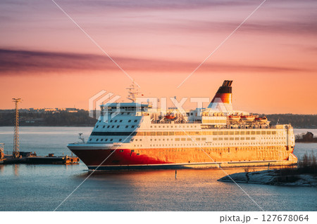 Helsinki, Finland. View Of Modern Ferry Ferryboat Floating Island At Sunrise Sky 127678064