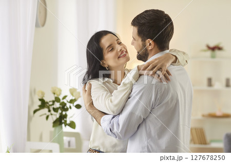 Romantic Couple Embracing Happily At Home 127678250
