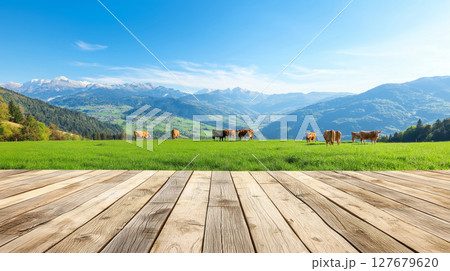 Scenic mountain pasture with cows on open wooden deck Scenic mountain pasture with cows on open wooden deck 127679620