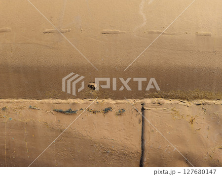 Rusty metal surface showing wear and paint chipping outdoors 127680147