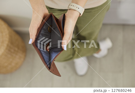 No money empty wallet close up, hands opening holding purse without cash after bankruptcy paying  127680246