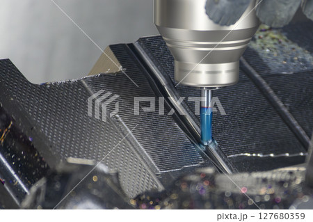 The CNC milling machine finish cut the mold parts by solid ball nose end mill tool. The CNC milling machine finish cut the mold parts by solid ball nose end mill tool. 127680359