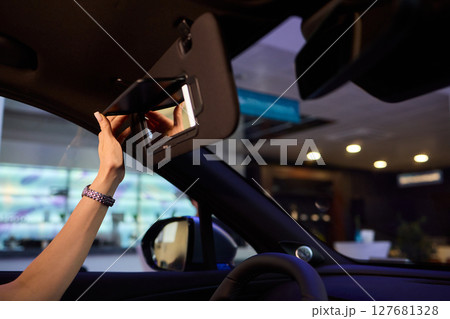 The modern car interior features a sleek vanity mirror that highlights both functionality and style 127681328