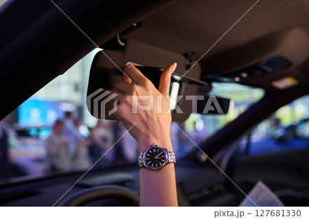 The modern car interior features a sleek vanity mirror that highlights both functionality and style 127681330