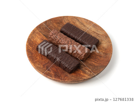 Protein bar isolated, chocolate energy paleo snack, healthy cereal nutrition with nuts, fruits, muesli Protein bar isolated, chocolate energy paleo snack, healthy cereal nutrition with nuts, fruits, muesli 127681338