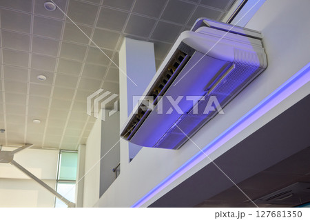 A modern air conditioning unit designed to fit seamlessly into a contemporary space A modern air conditioning unit designed to fit seamlessly into a contemporary space 127681350