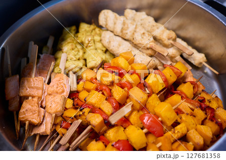 Delicious and Colorful Skewers of Grilled Vegetables and Juicy Meats for Everyone to Enjoy Delicious and Colorful Skewers of Grilled Vegetables and Juicy Meats for Everyone to Enjoy 127681358
