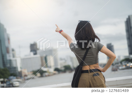 Solo tourism concept young southeast asian woman and teenager blogger. World travel explorer has local cultural experience with smartphone over Chao Phraya river in Bangkok Asia Thailand Solo tourism concept young southeast asian woman and teenager blogger. World travel explorer has local cultural experience with smartphone over Chao Phraya river in Bangkok Asia Thailand 127681489