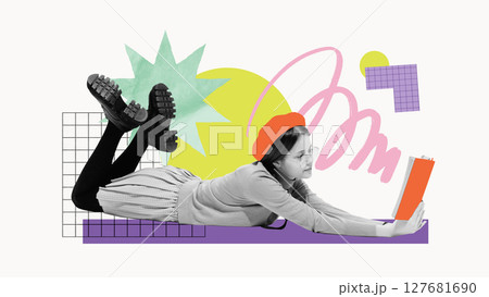 Girl lying on floor, reading book surrounded by graphic educational elements. Youth-focused visuals Girl lying on floor, reading book surrounded by graphic educational elements. Youth-focused visuals 127681690