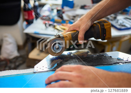 Utilizing Power Tools in the Workshop for Various Metalworking Projects Effectively 127681889