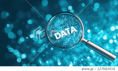 Conceptual image of a magnifying glass revealing DATA over data analytics, representing leadership  127682018