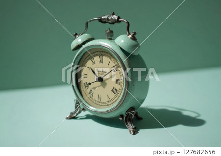 Antique Clock Ticking Time Away on Green Background, Time Concept 127682656