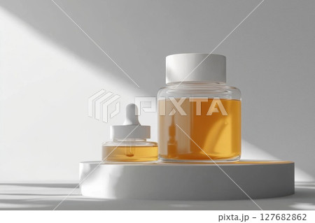 Serum Bottles Sit Nicely Against a Light White Background For Skincare Serum Bottles Sit Nicely Against a Light White Background For Skincare 127682862