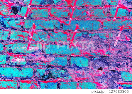 Peeling paint on a brick wall. Old brick wall with cracked peeling paint and metal pins Peeling paint on a brick wall. Old brick wall with cracked peeling paint and metal pins 127683506