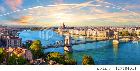 Chain bridge over Danube River in Budapest at sunset, with Parliament and Margaret Island, beautiful panorama of Hungary 127684011