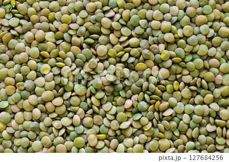 Pile of Green Lentil Grains Background Surface Texture 127684256