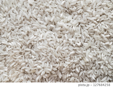Pile of White Rice Background Surface Texture 127684258