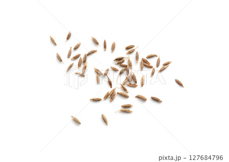 Cumin seed isolated. Caraway or fennel dry seeds close up, zeera macro, Indian cumin or zira grains Cumin seed isolated. Caraway or fennel dry seeds close up, zeera macro, Indian cumin or zira grains 127684796