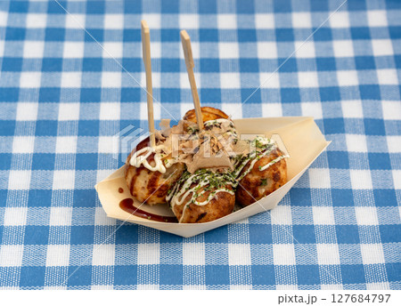 Takoyaki - traditional Japanese street food, outdoor snack with octopus Takoyaki fried balls Takoyaki - traditional Japanese street food, outdoor snack with octopus Takoyaki fried balls 127684797
