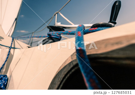 Winch capstan with rope on sailing boat. 127685031