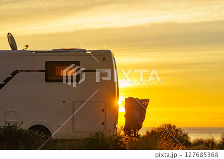 Caravan on nature in the morning at sunrise 127685368