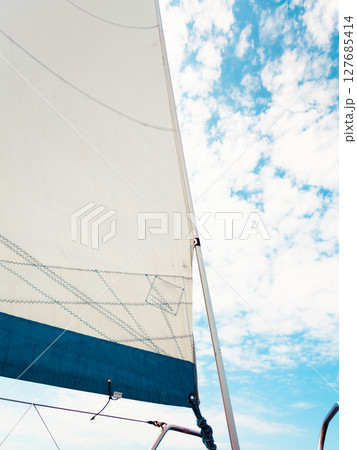Detailed closeup of sail on sailboat Detailed closeup of sail on sailboat 127685414