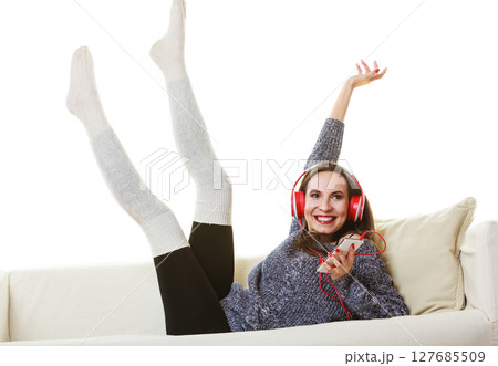 Woman with headphones listening music Woman with headphones listening music 127685509